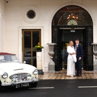 Hotel entrance wedding cars