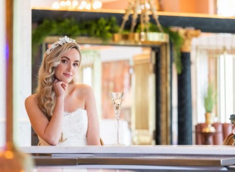 Bride with glass of champagne